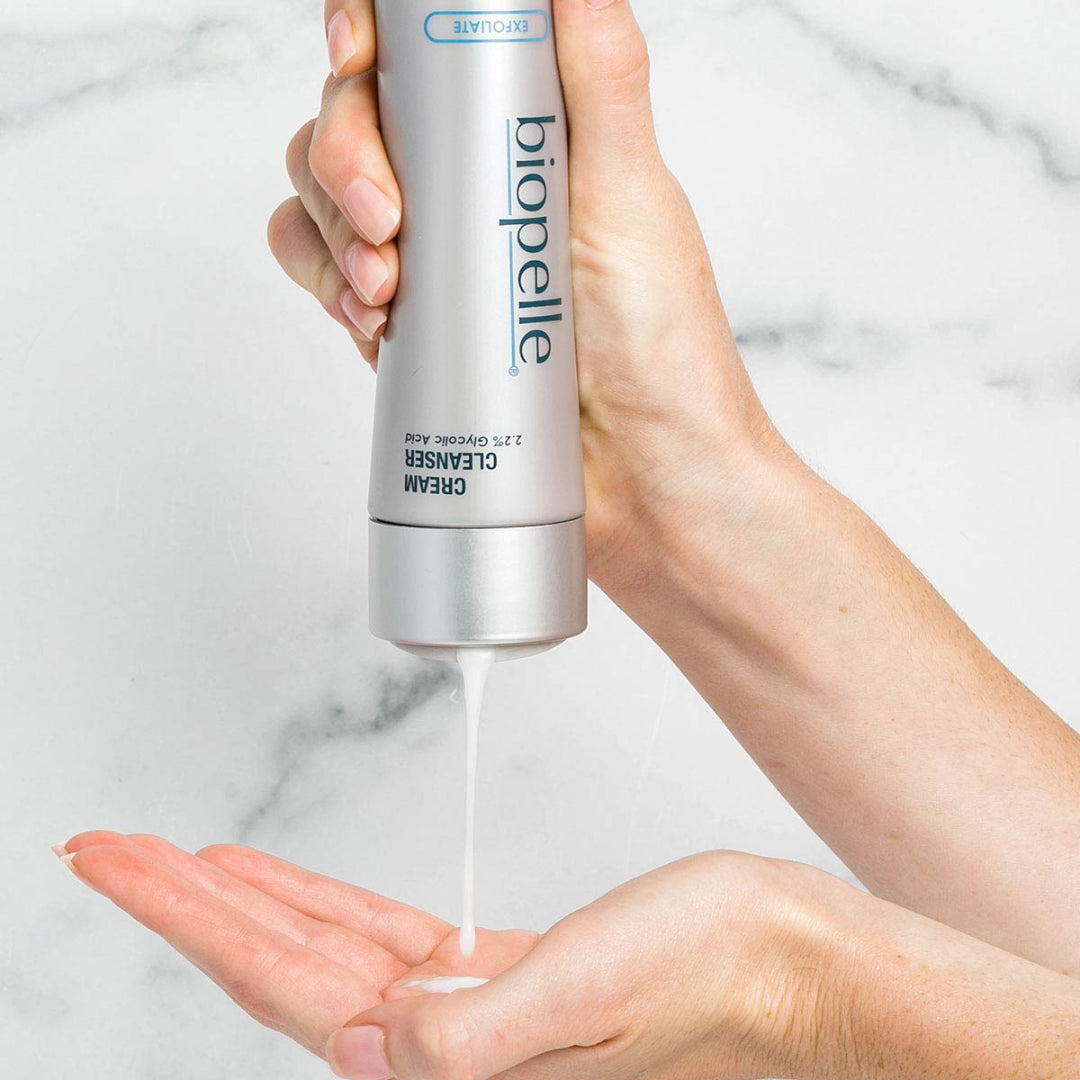 Biopelle Exfoliate Cream Cleanser 6 fl oz being pumped into hand – 2.2% Glycolic Acid cream cleanser for gentle daily exfoliation and smoother skin texture