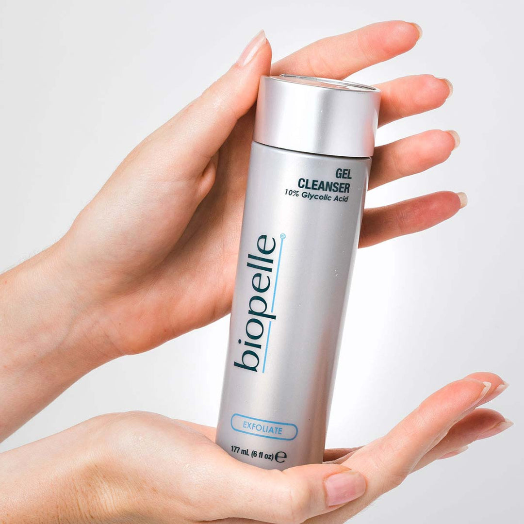 Biopelle Exfoliate Cream Cleanser and Gel Cleanser side by side on marble counter – glycolic acid cleansers for gentle daily exfoliation and skin renewal