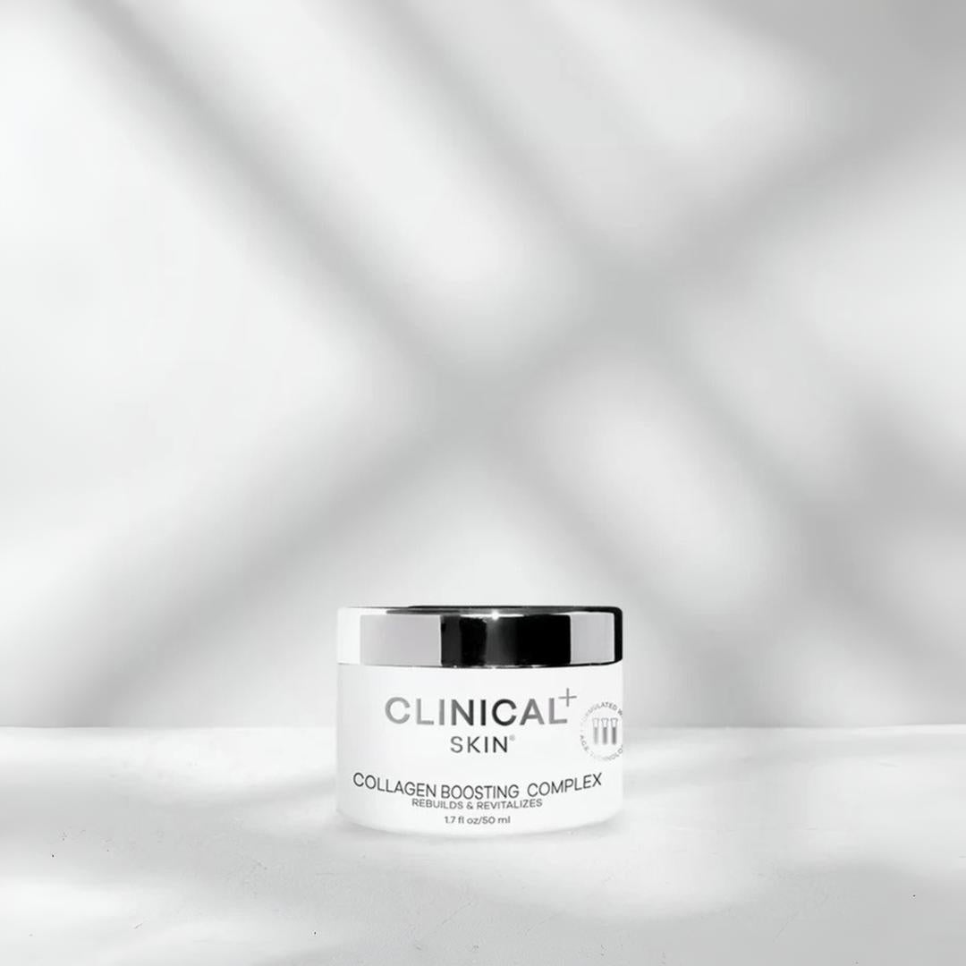Clinical Skin Collagen Boosting Complex 50ml white jar on gray background with dramatic light shadows – anti-aging collagen cream for rebuilding skin firmness and revitalizing complexion