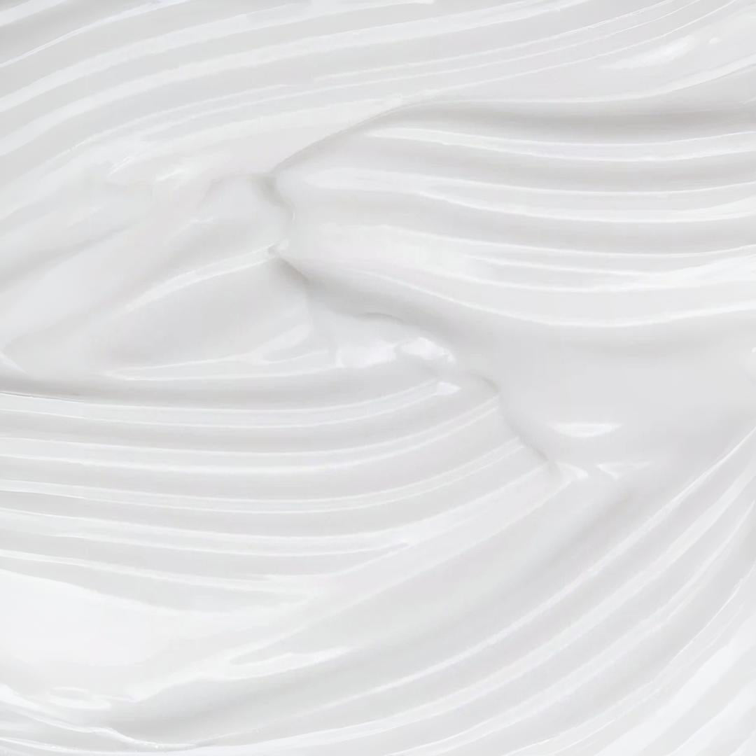 Clinical Skin Ultra-Light Balance Renew Moisturizer texture close-up – rich white cream with sweeping wave-like ridges showing the luxurious sheer veil moisturizing formula texture