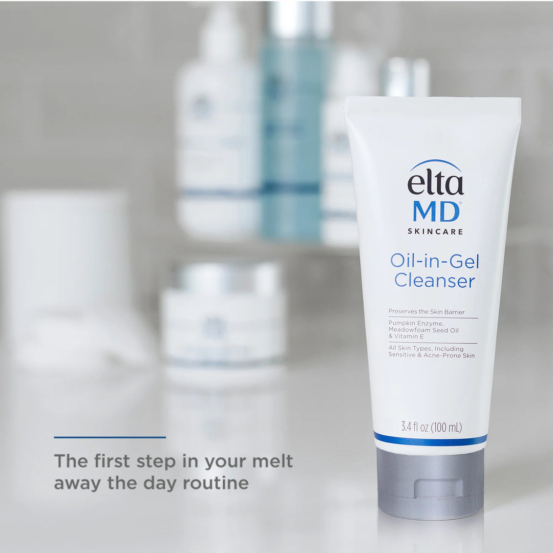 EltaMD Oil-in-Gel Cleanser 3.4 fl oz tube in bathroom setting with other skincare products as the first step in your melt away the day routine