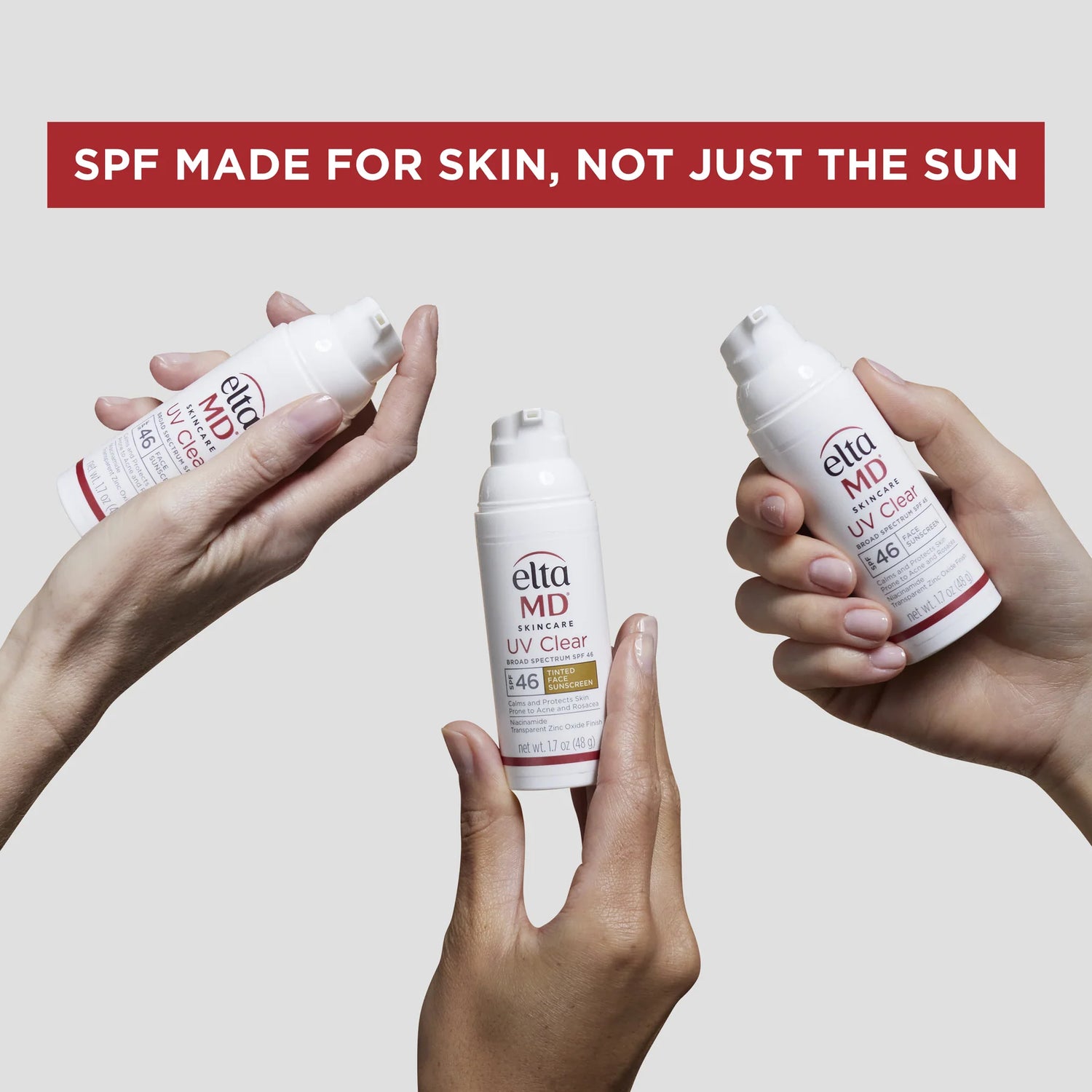 EltaMD UV Daily Tinted Broad-Spectrum SPF 40 lifestyle – three hands holding EltaMD sunscreen bottles with tagline SPF made for skin not just the sun on gray background