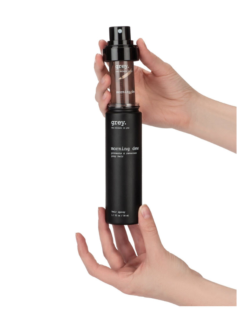Hands inserting a GoneGrey Morning Dew Eco Refill Cartridge into the Morning Dew hair spray bottle, 1.7 fl oz / 50ml