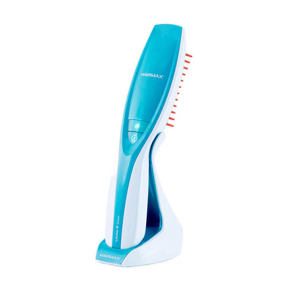 HairMax Ultima 9 Classic LaserComb Hair Growth Device teal and white laser comb on charging stand