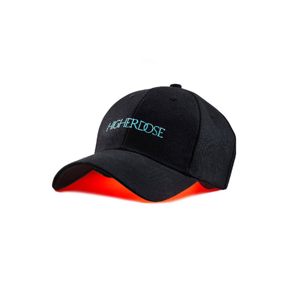HigherDose Red Light Hat black baseball cap with teal logo and glowing red light visible under the brim