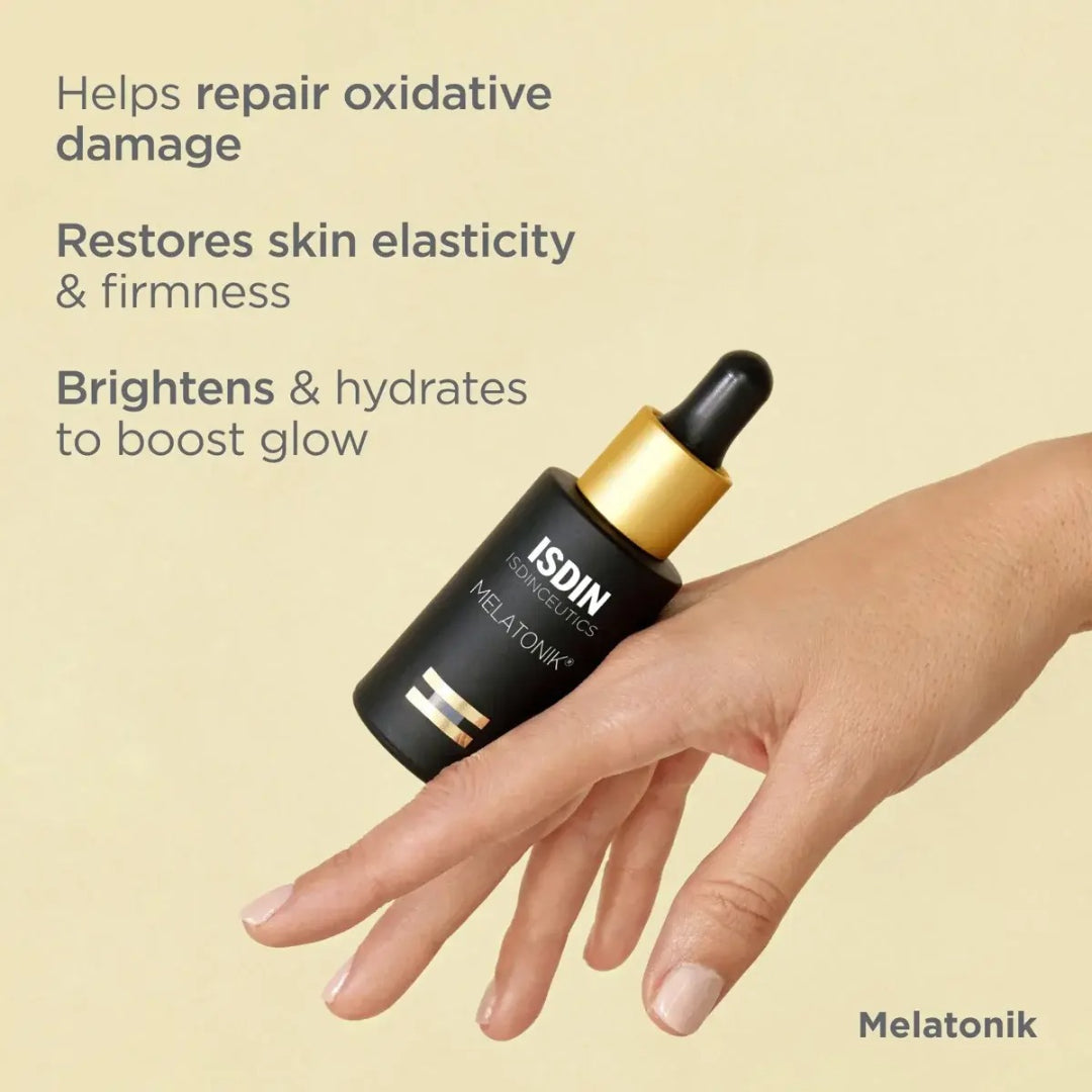 Hand holding ISDIN Melatonik bottle with text helps repair oxidative damage restores skin elasticity and firmness brightens and hydrates to boost glow