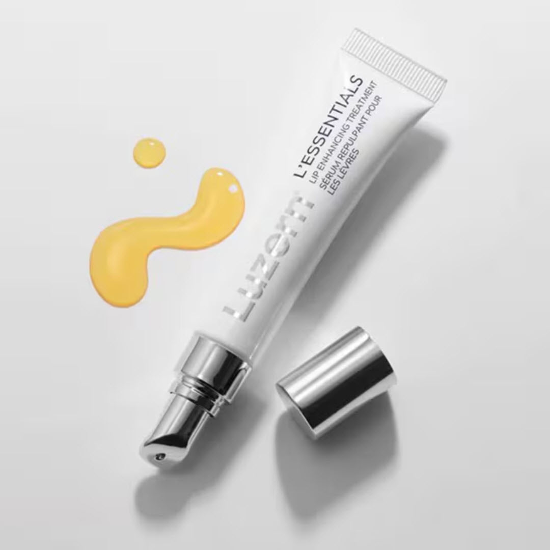 Luzern L'Essentials Lip Enhancing Treatment tube styled with its cap and a golden oil-serum texture swatch