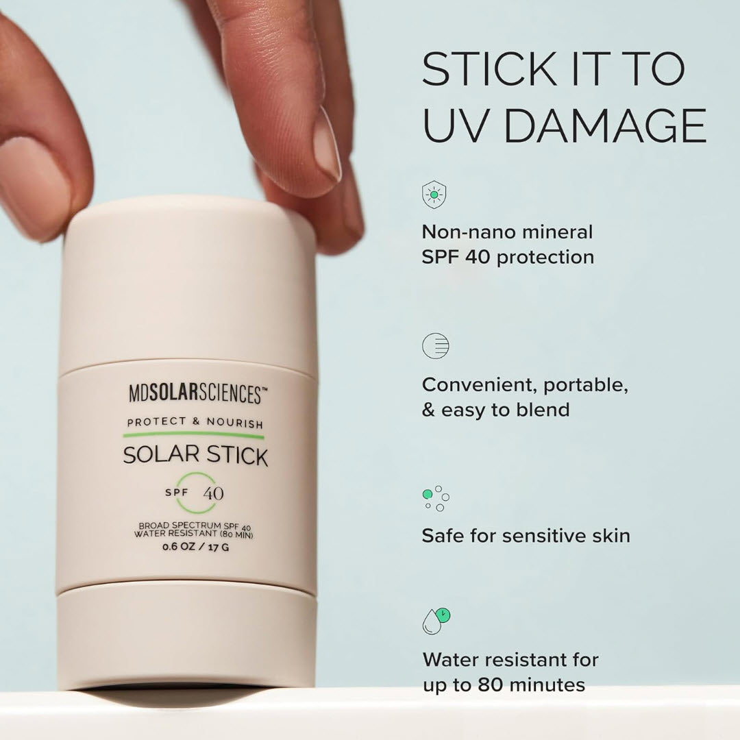 Hand holding MDSolarSciences Solar Stick with non-nano mineral SPF 40, portable, sensitive-skin-safe and water-resistant benefit callouts