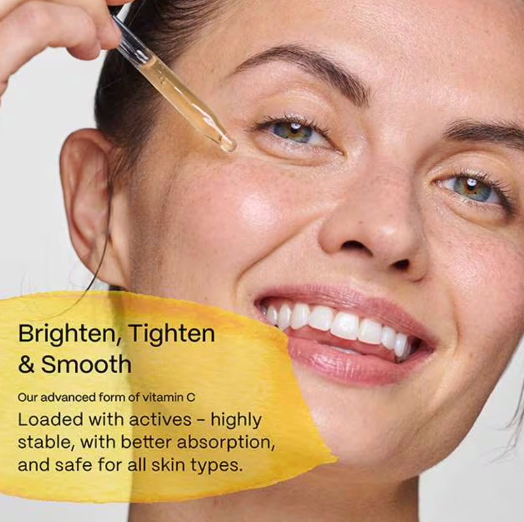 Woman applying Mad Hippie Vitamin C Serum with dropper to brighten, tighten, and smooth skin