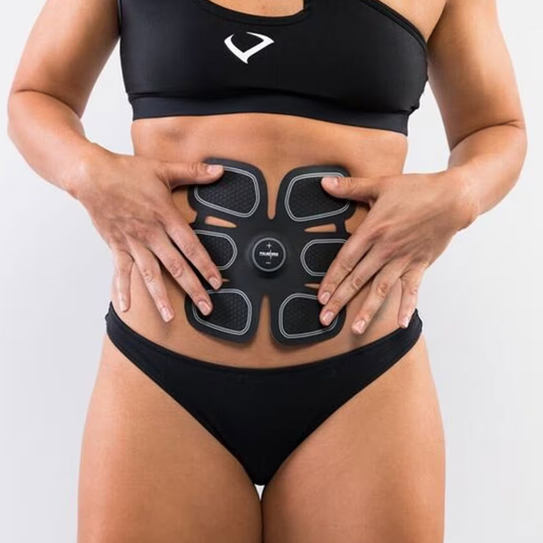 Woman wearing the Numiere ABS NRG Training Revolution EMS ab belt on her abdomen