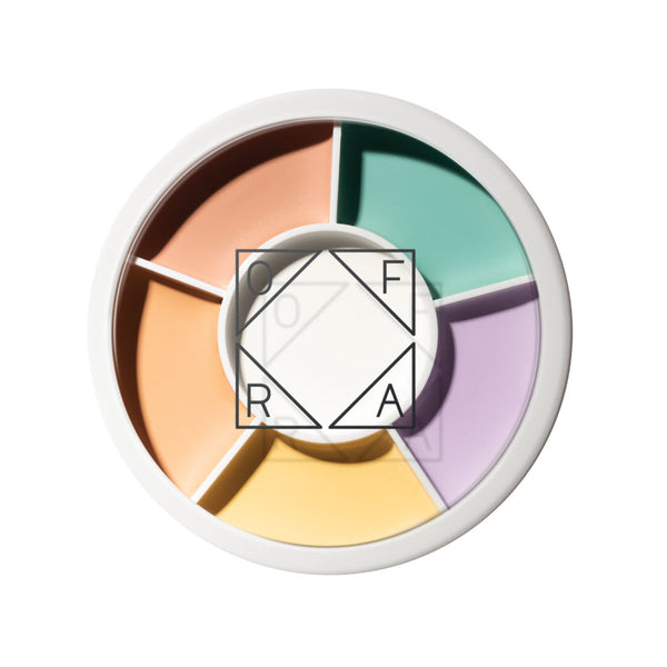 OFRA Cosmetics Magic Roulette Concealer color-correcting wheel with peach, orange, green, purple, and yellow shades