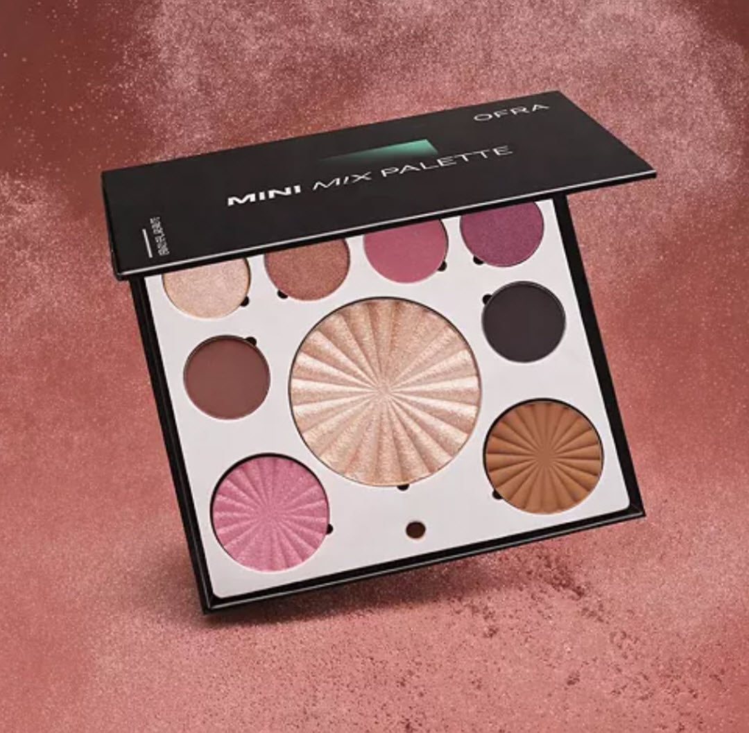 OFRA Cosmetics Mini Mix Face Palette Plum Crush 9-pan face and eye palette styled on a shimmering pink background