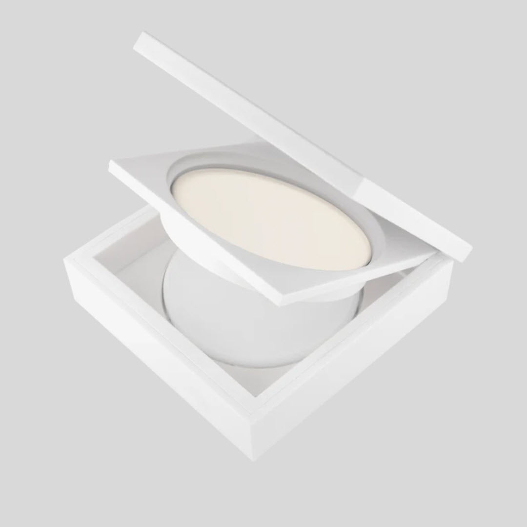 OFRA Cosmetics Oil Control Pressed Powder compact open at an angle showing the powder pan and case