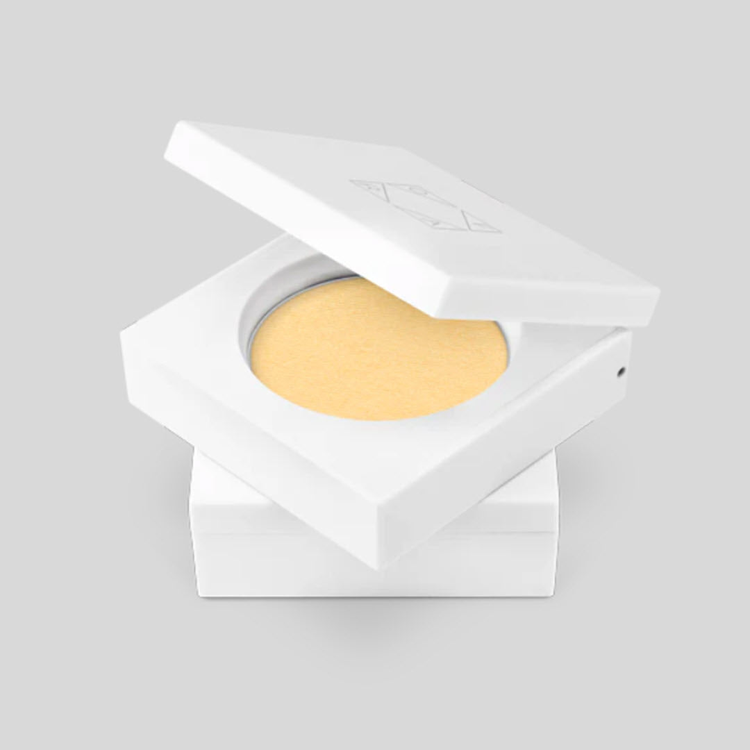 Open OFRA Cosmetics Pressed Banana Powder compact showing the pressed powder pan