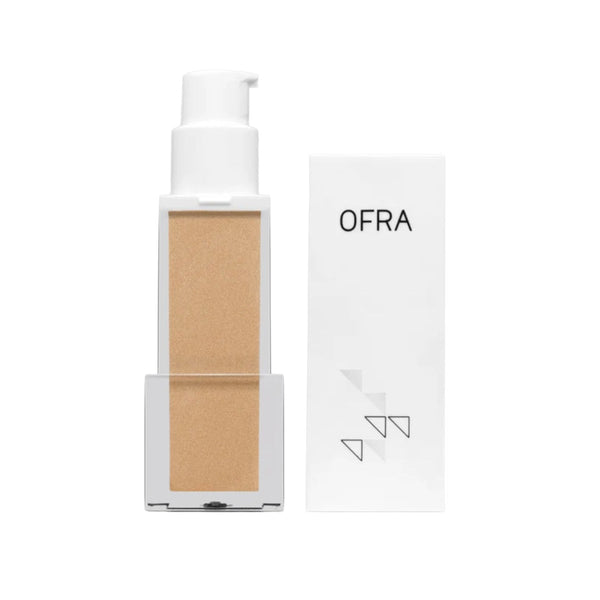 OFRA Cosmetics Rodeo Drive Primer pump bottle shown next to its retail box, a golden champagne illuminating primer