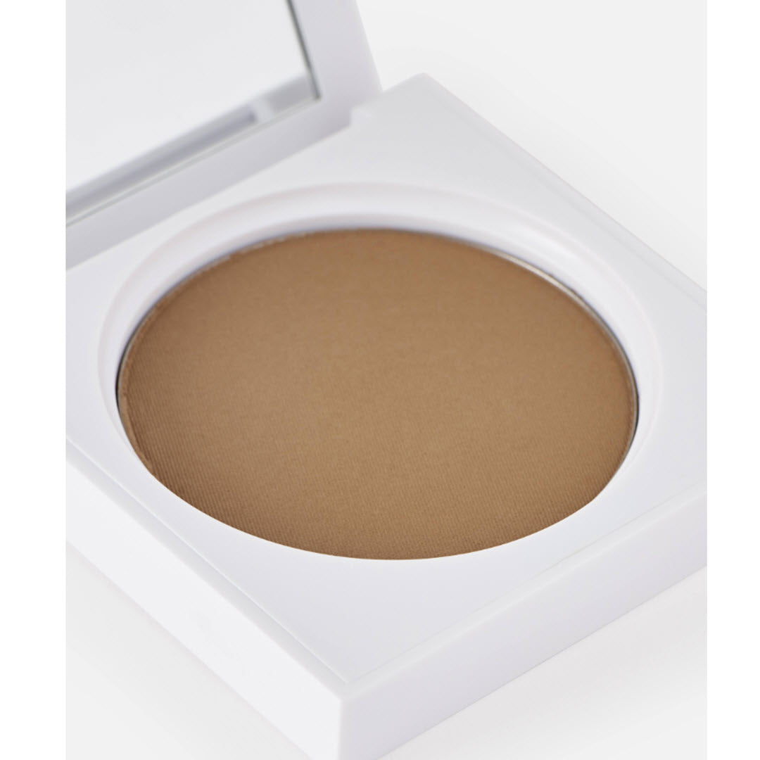Close-up of the open OFRA Cosmetics Versatile Matte Bronzer compact showing the pressed powder pan and mirror
