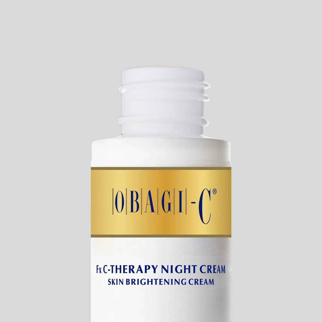 Obagi-C Fx C-Therapy Night Cream close-up of open bottle showing gold Obagi-C label on gray background