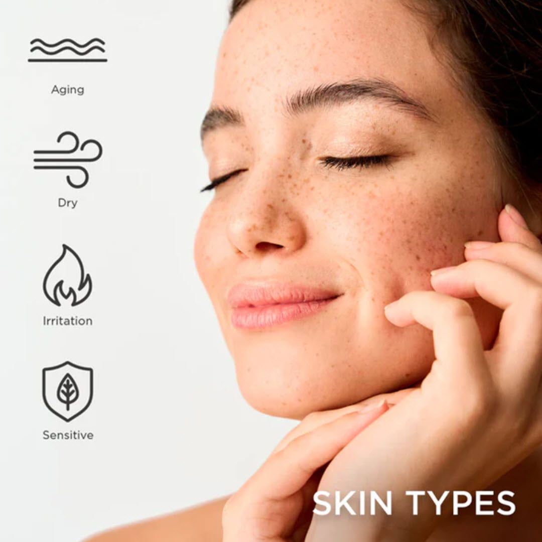 Woman applying Osmosis Immerse Restorative Facial Oil to her cheek, suited for aging, dry, irritated and sensitive skin types
