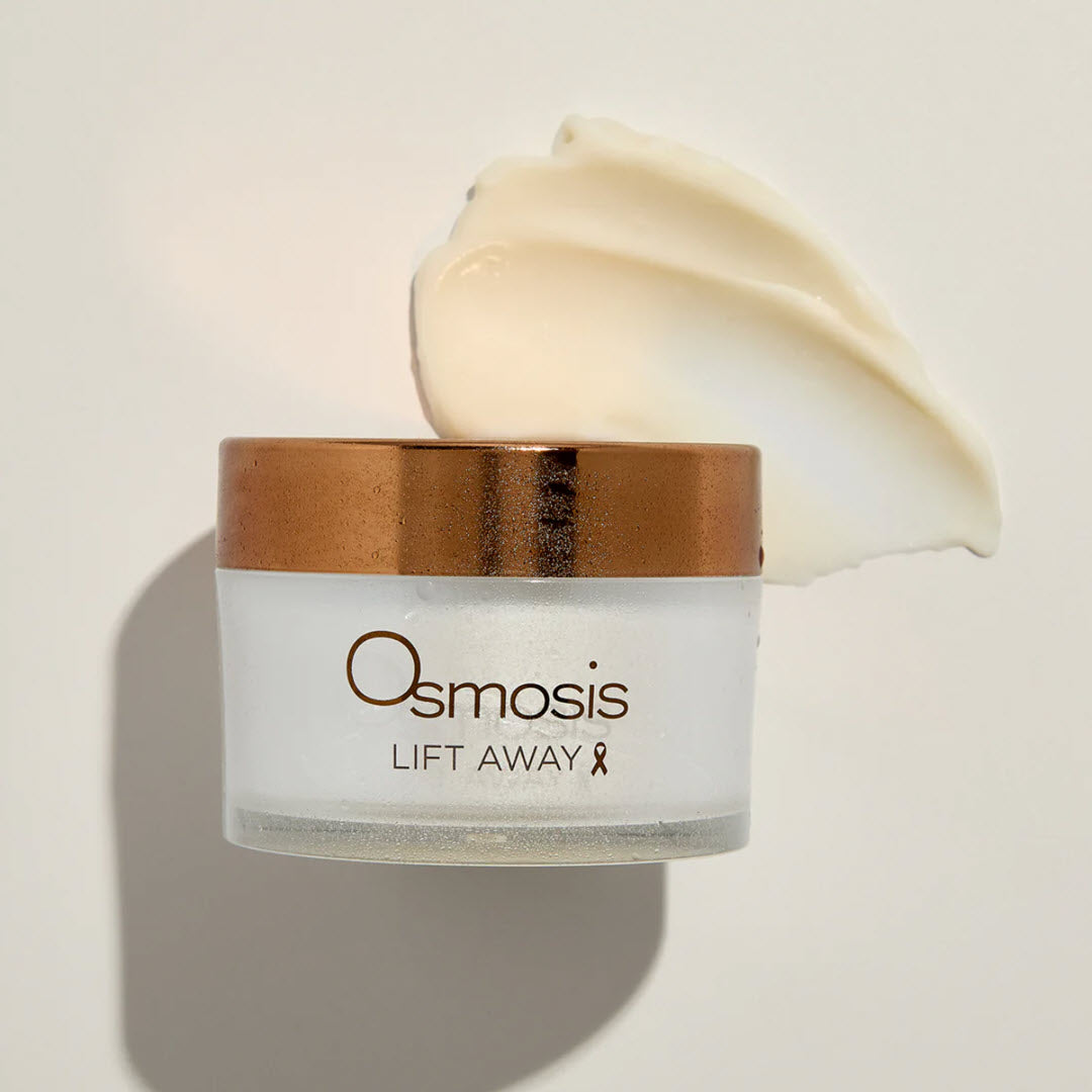 Osmosis Lift Away Cleansing Balm jar with a swipe of the creamy balm texture