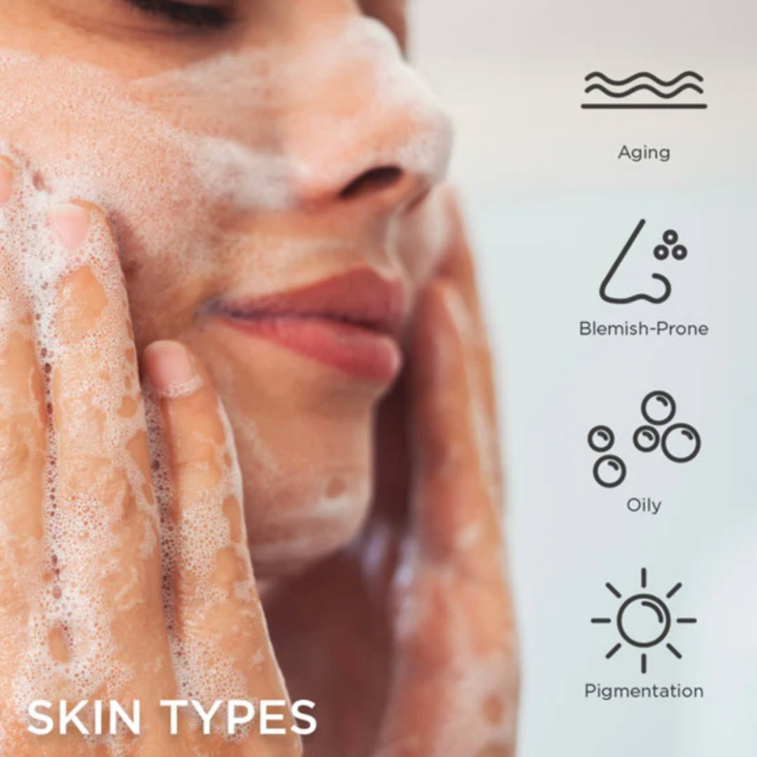 Woman washing her face with Osmosis Purify Enzyme Cleanser, suited for aging, blemish-prone, oily and pigmented skin types