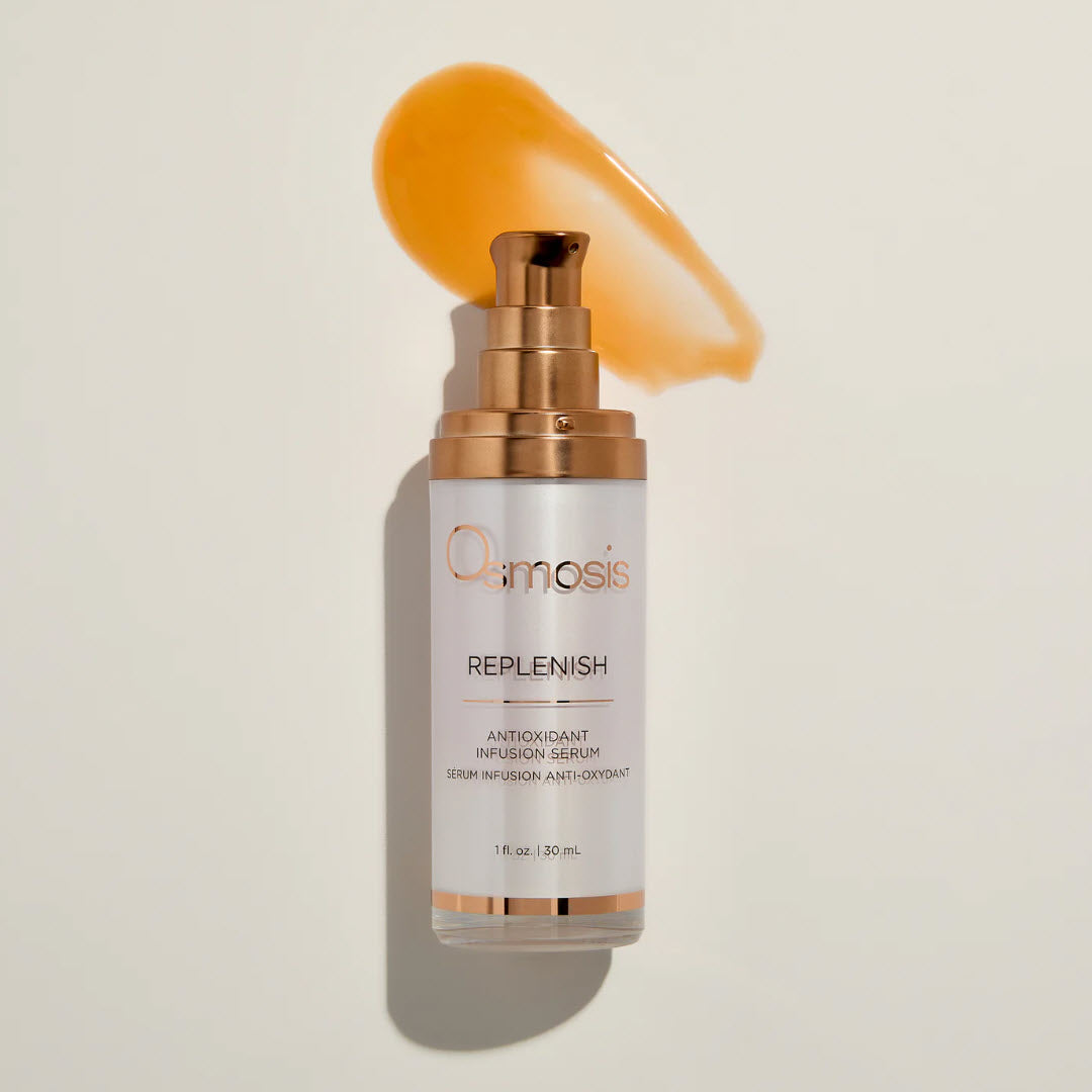 Osmosis Replenish Antioxidant Infusion Serum bottle with a swipe of the golden antioxidant-rich serum