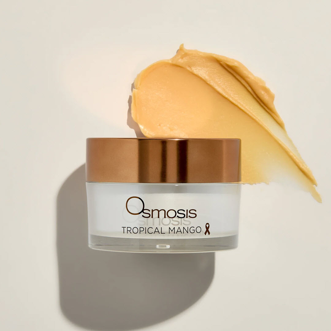 Osmosis Tropical Mango Barrier Repair Mask jar with a swipe of the rich, buttery balm formula