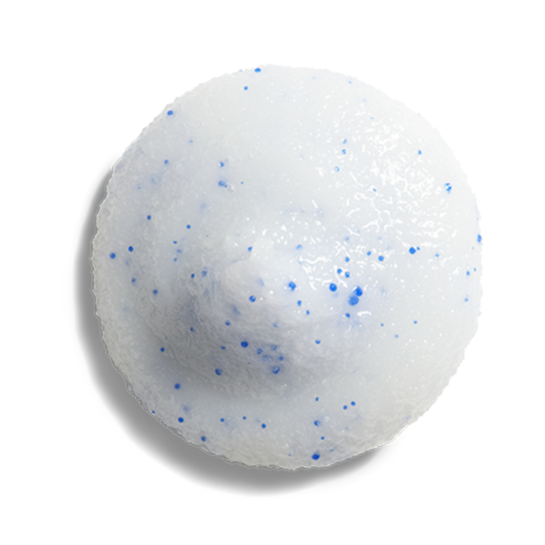 ZO Skin Health Dual Action Scrub texture close-up – white scrub formula with blue vitamin E beads for gentle yet effective physical exfoliation