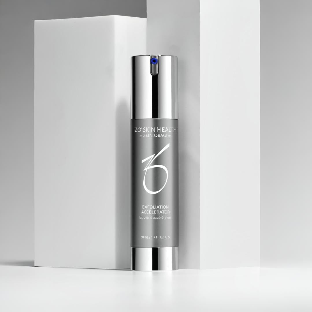 ZO Skin Health Exfoliation Accelerator pump bottle on white display blocks – AHA exfoliating treatment to resurface and renew skin texture