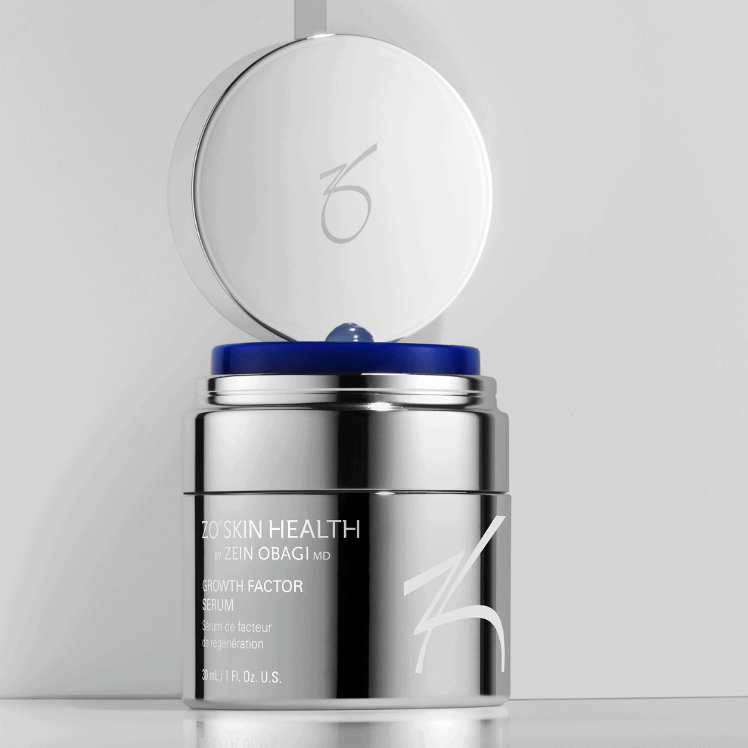 ZO Skin Health Growth Factor Serum Plus silver jar with open lid showing blue interior – advanced growth factor treatment for skin rejuvenation and firmness