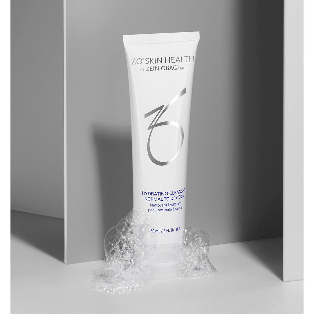 ZO Skin Health Hydrating Cleanser Normal to Dry Skin white tube with botanical styling on gray surface – nourishing daily facial cleanser for soft, hydrated skin