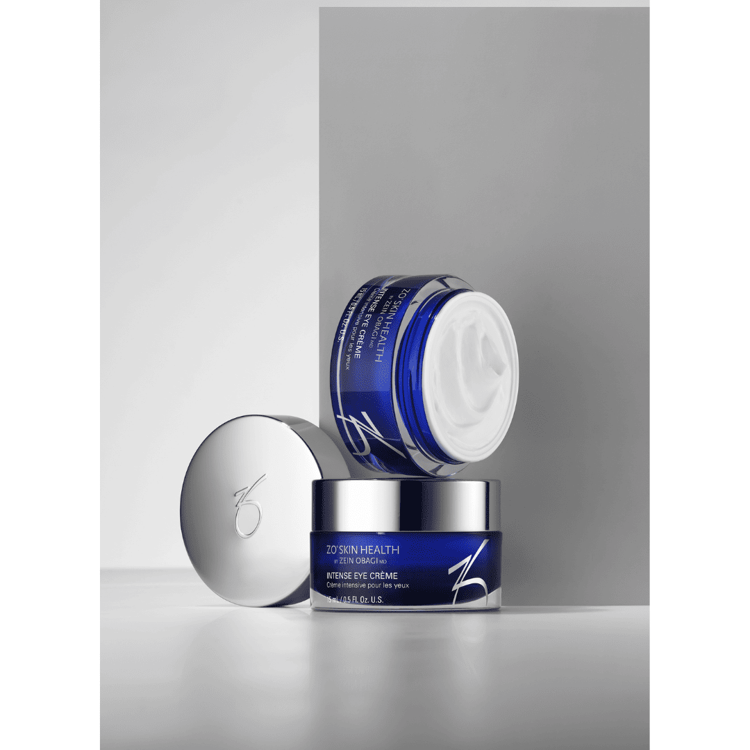 ZO Skin Health Intense Eye Crème navy blue jars with open lid showing rich white cream – advanced under-eye treatment for wrinkles and puffiness