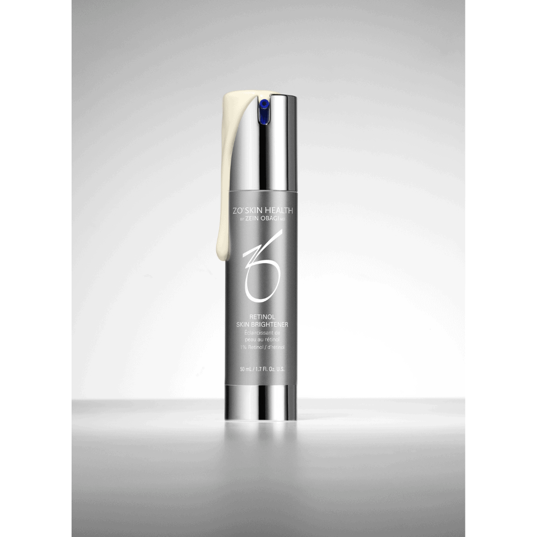 ZO Skin Health Retinol Skin Brightener 1% silver pump bottle with cream swatch on reflective gray surface – advanced retinol treatment for skin brightening