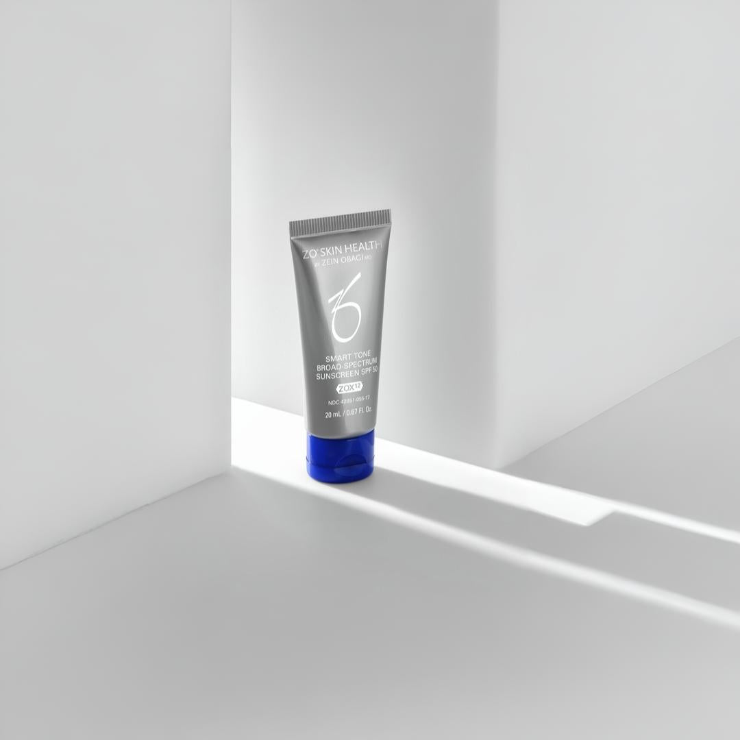 ZO Skin Health Smart Tone Broad Spectrum Sunscreen SPF 50 20mL tube in white geometric corner with dramatic light – portable tinted sunscreen for on-the-go protection