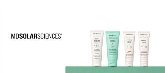 Four MDSolarSciences skincare tubes arranged on a mint green surface against a white background, with the MDSolarSciences brand name printed in black on the left.